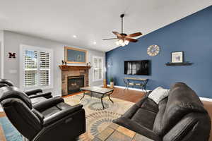Great room with, vaulted ceilings sliding door to backyard, plantation shutters and gas fireplace