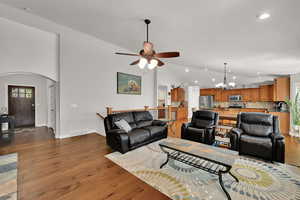 Great room with, vaulted ceilings sliding door to backyard, plantation shutters and gas fireplace