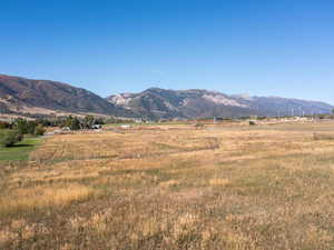 View of mountain backdrop with rural landscape