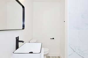 Bathroom with vanity and wood finished floors