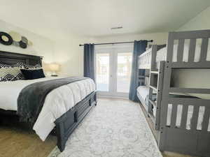 Bedroom featuring access to exterior and french doors