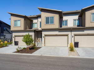 Craftsman house featuring driveway, an attached garage, and board and batten siding