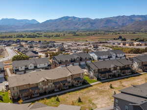 Aerial view of residential area featuring a mountainous background