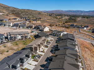 Aerial perspective of suburban area with a mountain backdrop