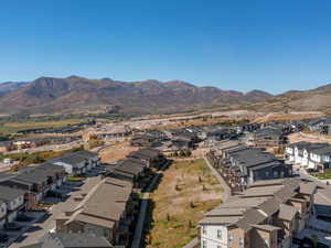 Aerial view of residential area featuring a mountain backdrop