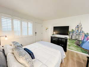 Bedroom featuring wood finished floors