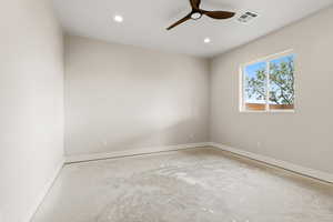 Spare room featuring ceiling fan, concrete flooring, and recessed lighting