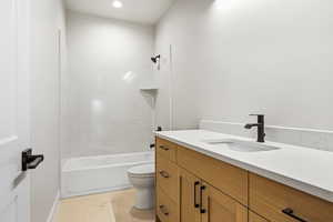 Bathroom with vanity and shower / bath combination