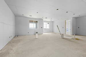 Spare room featuring concrete flooring