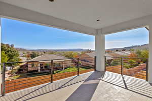 Balcony featuring a mountain view and a residential view