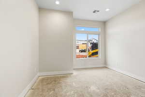 Unfurnished room featuring recessed lighting