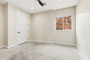 Unfurnished room featuring recessed lighting, ceiling fan, and unfinished concrete floors