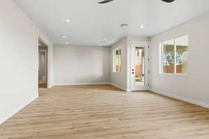 Spare room with light wood-style flooring, recessed lighting, and a ceiling fan