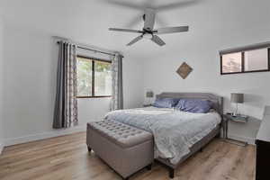 Primary Bedroom featuring floors and a ceiling LVT and ceiling fan