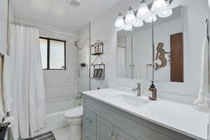 Full bathroom with shower / bathtub combination and vanity