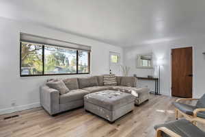 Living area with light wood-style flooring