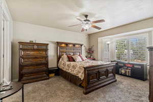 Bedroom featuring carpet flooring and a ceiling fan