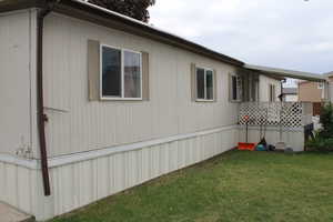 View of home's exterior featuring a lawn