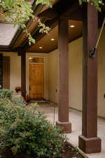 Doorway to property with stucco siding