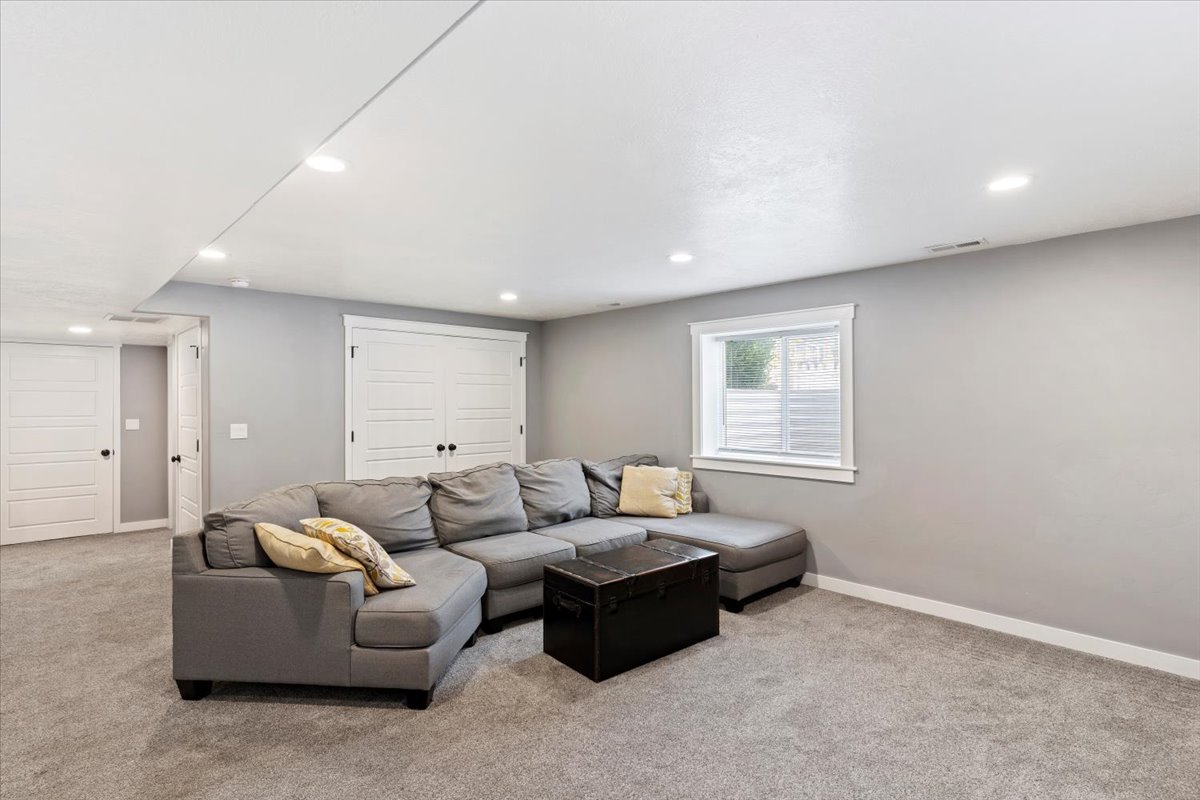 Living room featuring light carpet and recessed lighting
