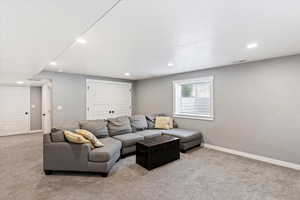 Living room featuring light carpet and recessed lighting
