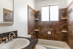 Full bath with shower / bathtub combination and vanity