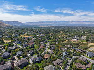 Aerial view of residential area featuring a mountainous background