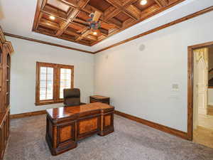 Carpeted office featuring ornamental molding, coffered ceiling, ceiling fan, recessed lighting, and arched walkways