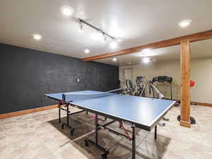 Playroom featuring recessed lighting and rail lighting