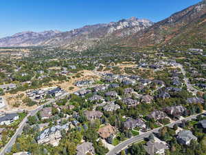 View of property location with a mountain backdrop and nearby suburban area
