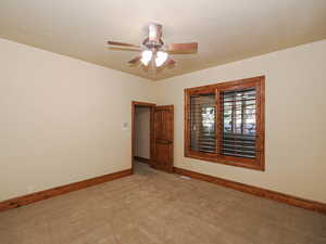 Bedroom 6 with light carpet and ceiling fan
