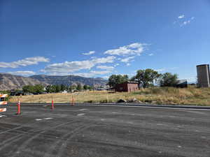 View of parking / parking lot with a mountain view