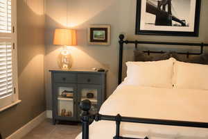 Bedroom featuring baseboards and carpet floors