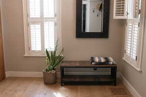 Detailed view of baseboards and wood finished floors