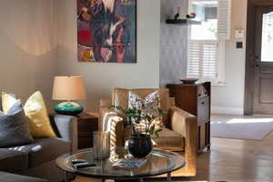 Living area featuring wood finished floors and baseboards