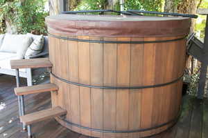 Wooden deck with a hot tub