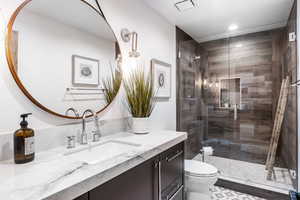 Full bath with vanity and a shower stall