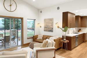 Living area featuring light wood-style floors and recessed lighting