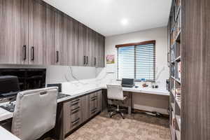 Office space featuring built in desk