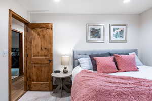 Bedroom featuring wood finished floors and recessed lighting