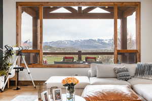 Living area featuring wood finished floors and a mountain view