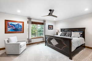 Bedroom with carpet floors, ceiling fan, and recessed lighting