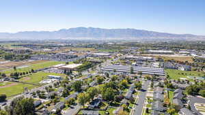 View of property location featuring a mountain backdrop and nearby suburban area