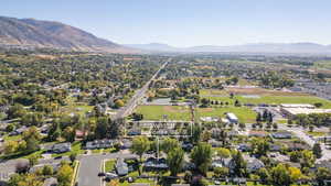 Aerial perspective of suburban area with a mountain backdrop