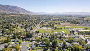 View of property location featuring nearby suburban area and a mountain backdrop