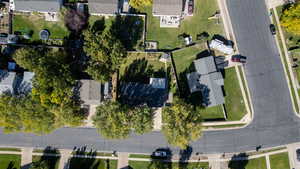 Aerial view of property's location with nearby suburban area