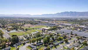 View of property location with a mountainous background and nearby suburban area