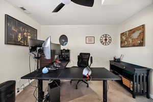 Office featuring light colored carpet and ceiling fan