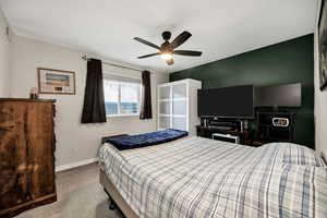 Bedroom featuring carpet flooring and ceiling fan