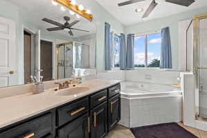 Primary bathroom featuring separate tub and shower, as well as toilet room.